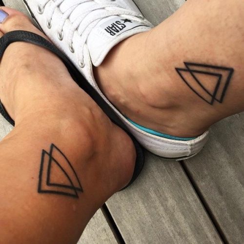 Modern tattoo of triangles.